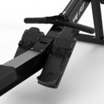 Close-up of Air Rower LF-AR 3 foot pedal with two-button adjustment for various shoe sizes.