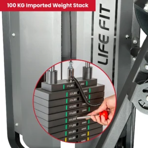 A detailed view of the 100 kg imported weight stack on a LIFE FIT machine. A hand inserts the pin for easy selection, with clear labels for both LBS and KG to allow for precise, progressive training.
