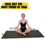 girl doing yoga at mat