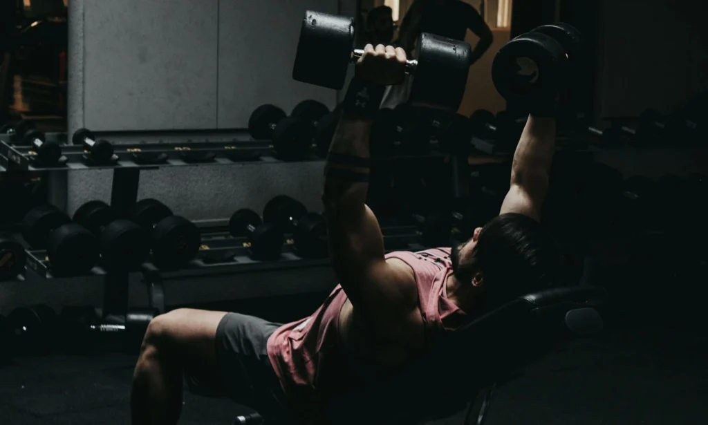 a man doing workout with adjustable gym bench