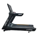 A direct side profile of the LIFE FIT LF-8700 commercial treadmill, clearly showing its sturdy frame, the full length of the running deck, and prominent branding.