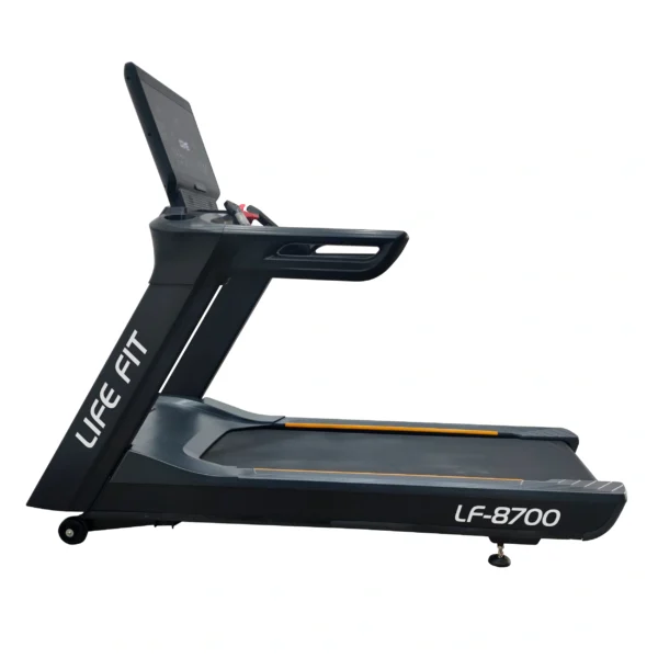 A direct side profile of the LIFE FIT LF-8700 commercial treadmill, clearly showing its sturdy frame, the full length of the running deck, and prominent branding.