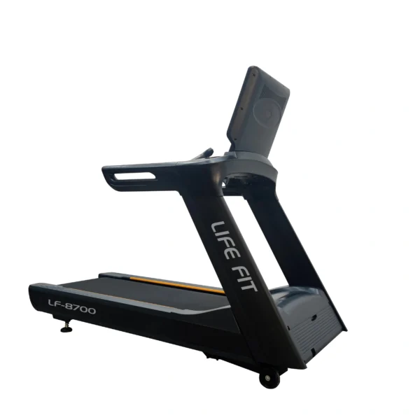 A rear three-quarter view of the LIFE FIT LF-8700 treadmill, showcasing the modern design of the console's back, the full side profile, and branding.