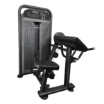 Side view of the Life Fit M1 preacher curl machine, highlighting the weight stack shroud and the profile of the seat and arm pad.